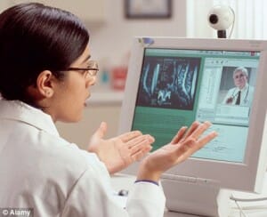 Doctor Consults Specialist and Discuss Readiology Image via Computer